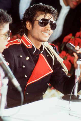 <p>Michael Putland/Getty</p> Michael Jackson at a press conference in 1983