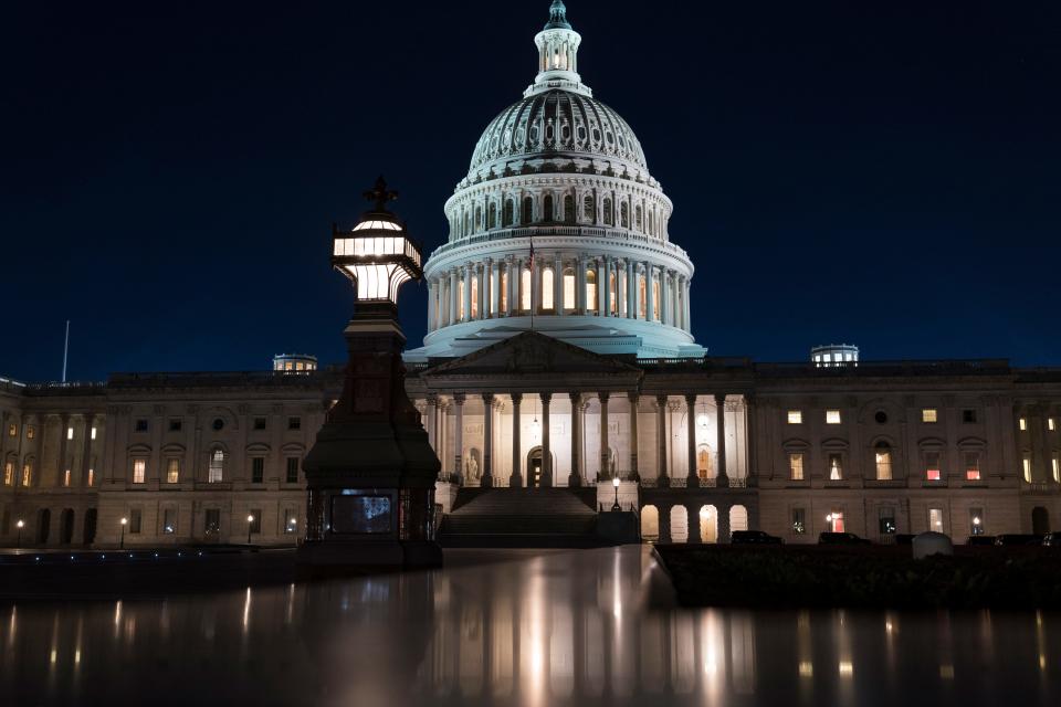 The Capitol is seen at dusk Friday during an impasse in negotiations on President Joe Biden's $1.9 trillion COVID-19 relief bill.