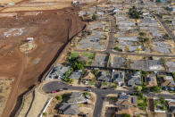 The construction progress at Ka La’i Ola, a housing development aiming to provide relief and stable housing for wildfire victims, is pictured on Sunday, July 7, 2024, in Lahaina, Hawaii. (AP Photo/Mengshin Lin)