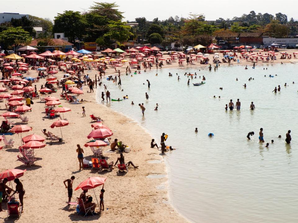 People enjoy the man-made beach in 2012 in Rio de Janeiro, Brazil.