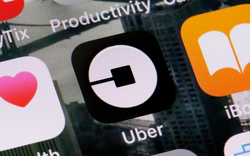 The so-called 'gig economy' includes Uber drivers, who are paid per task - AP
