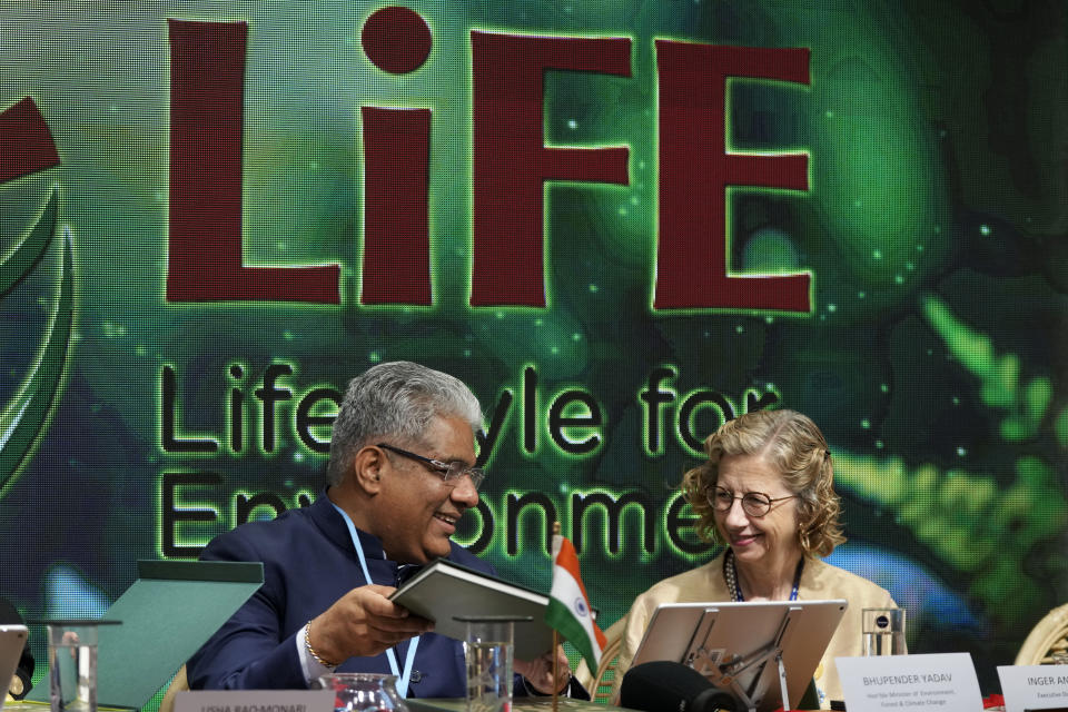 Bhupender Yadav, minister of environment, forest and climate change, left, and Inger Andersen, UNEP executive director, talk during a session at the India Pavilion at the COP27 U.N. Climate Summit, Monday, Nov. 14, 2022, in Sharm el-Sheikh, Egypt. (AP Photo/Peter Dejong)