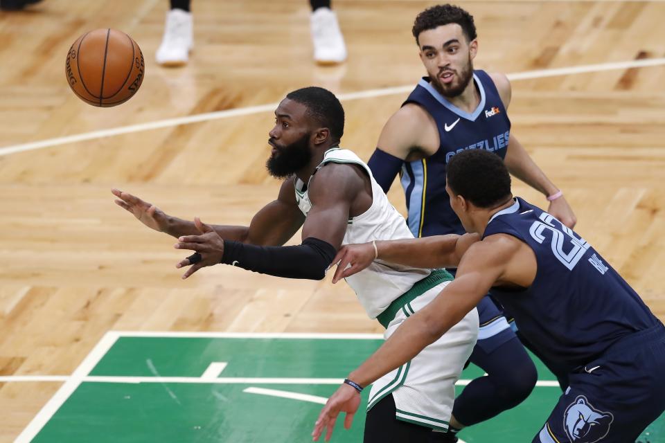 Boston Celtics' Jaylen Brown looses control of the ball to Memphis Grizzlies' Desmond Bane (22) during the first half of an NBA basketball game, Wednesday, Dec. 30, 2020, in Boston. (AP Photo/Michael Dwyer)