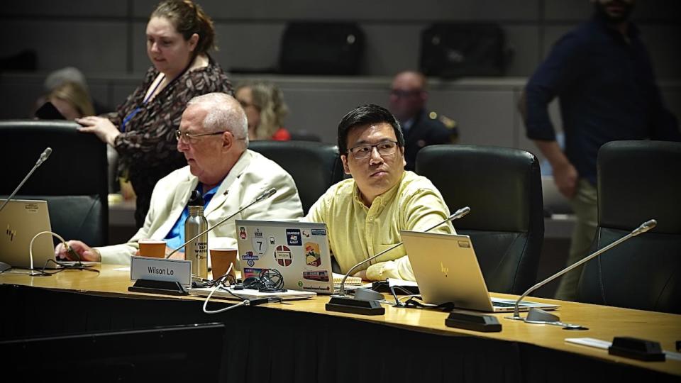 Barrhaven East Coun. Wilson Lo, right, moved to withdraw delegated authority from staff to pursue Sprung Structures to address a homelessness crisis driven by a surge of asylum seekers.