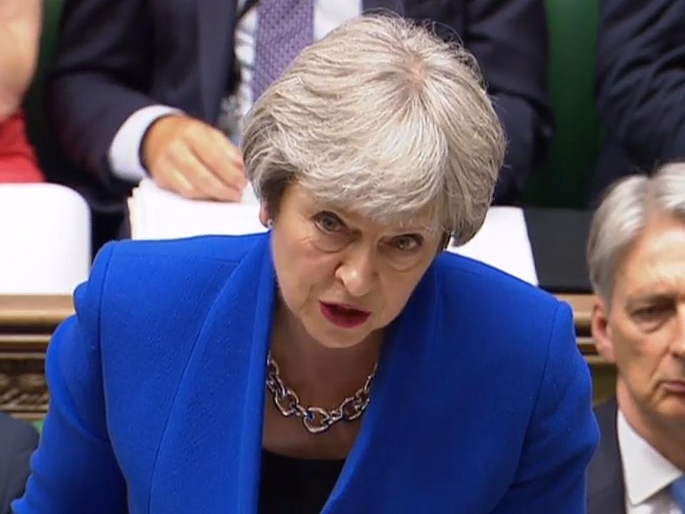 Theresa May condemns Trump's family separation policy and says she will challenge him on UK visit