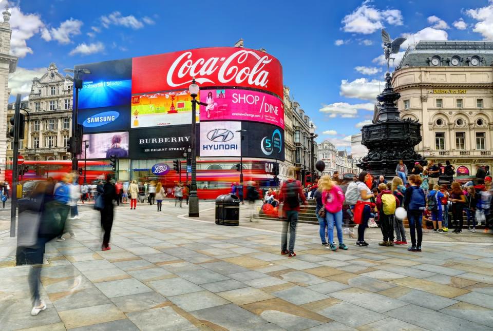 Billboards in Piccadilly Circus flash messages from Bridget’s diary (Getty Images)