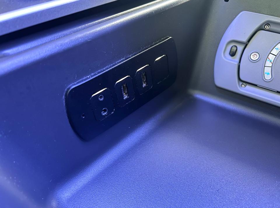 The two USB ports inside the cubby.