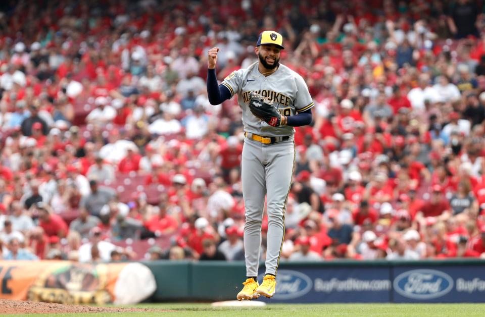 Brewers closer Devin Williams reacts after his third straight save in the three-game series sweep of the Reds on Sunday in Cincinnati.