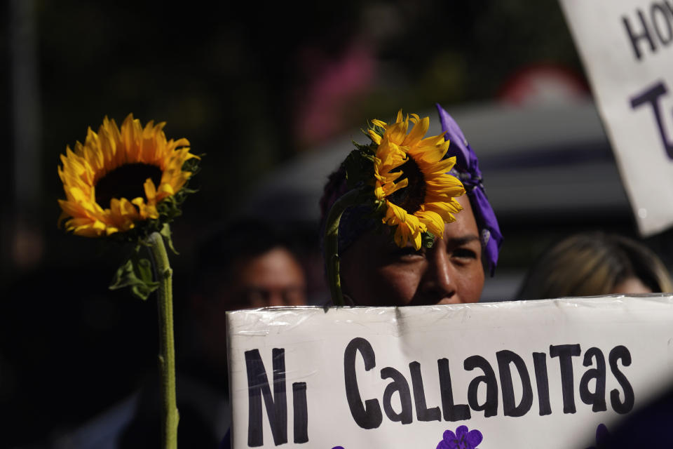 Feminist groups march to protest the murder of Ariadna Lopez, in Mexico City, Monday, Nov. 7, 2022. Prosecutors said Sunday an autopsy on Lopez who was found dead in the neighboring state of Morelos, showed she was killed by blunt force trauma. That contradicts a Morelos state forensic exam that suggested the woman choked on her own vomit as a result of intoxication. (AP Photo/Marco Ugarte)