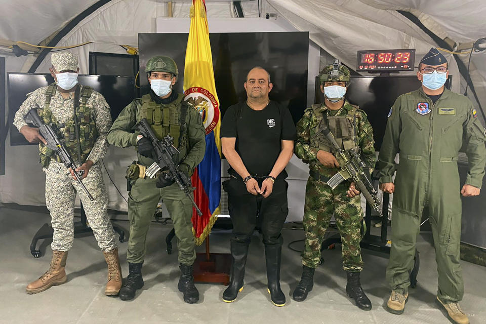 FILE — In this photo released by the Colombian presidential press office, one of the country's most wanted drug traffickers, Dairo Antonio Usuga, alias "Otoniel," leader of the violent Clan del Golfo cartel, is presented to the media at a military base in Necocli, Colombia, Oct. 23, 2021. Usage was sentenced to 45 years in prison, Tuesday, Aug. 8, 2023 in federal court, in New York. (Colombian presidential press office via AP, File)