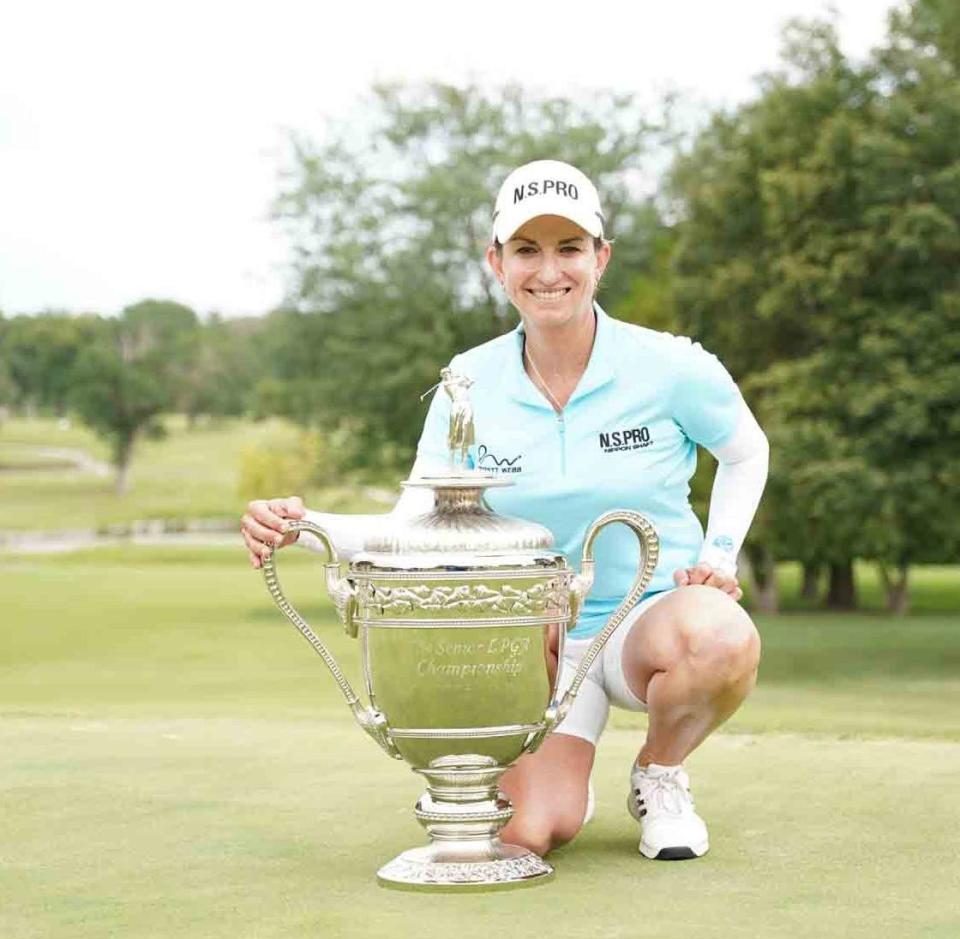 Karrie Webb poses with the trophy after winning the 2022 Senior LPGA Championship in Salina, Kansas on July 24, 2022.