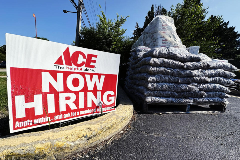 FILE - Hiring sign is displayed outside of a hardware store in Buffalo Grove, Ill., Sunday, July 9, 2023. A growing number of older adults are in debt in retirement, according to the 2022 Survey of Consumer Finances from the Federal Reserve. Supplementing retirement savings and Social Security benefits with part-time earnings can make your money go further and help you pay off remaining debt. (AP Photo/Nam Y. Huh, File)