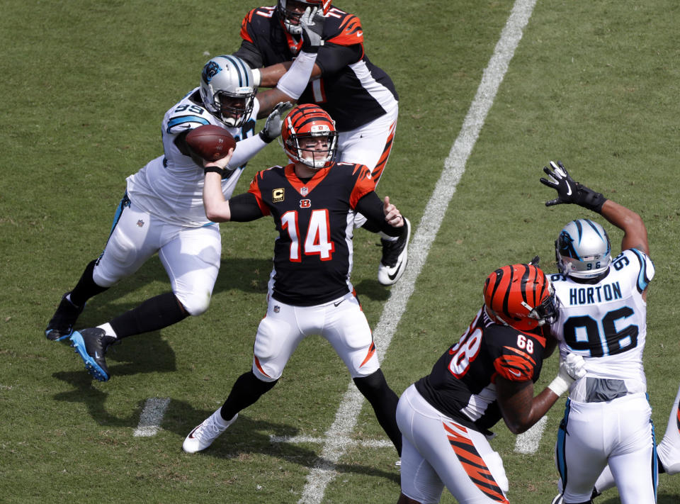 Cincinnati Bengals' Andy Dalton (14) looks to pass against the Carolina Panthers during the first half of an NFL football game in Charlotte, N.C., Sunday, Sept. 23, 2018. (AP Photo/Bob Leverone)