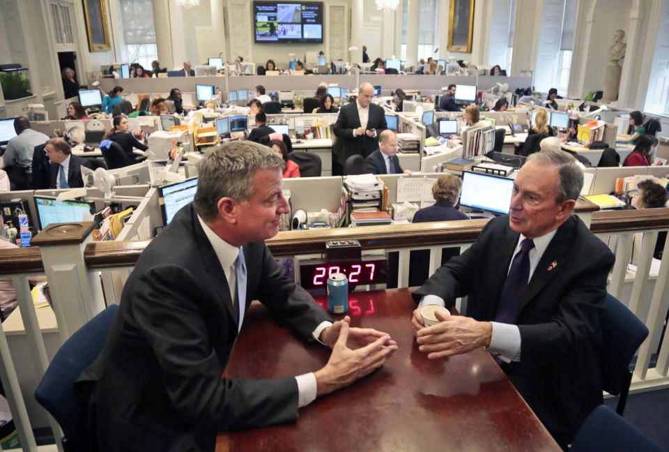 File-This photo from Wednesday, Nov. 6, 2013, shows New York City Mayor-elect Bill de Blasio, left, and Mayor Michael Bloomberg meeting in the "Bull Pen," at City Hall. Democrat Bill de Blasio campaign told a "tale of two cities" that resonated with voters who felt Bloomberg was out of touch and left a city that worked better for a well-off elite than for others. (AP Photo/Bebeto Matthews, File)