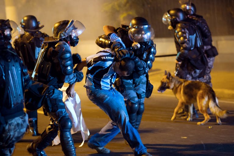 A protester is arrested by military police from the special unit Chope late on June 19, 2013 during clashes in the center of Niteroi, 10 kms from Rio de Janeiro