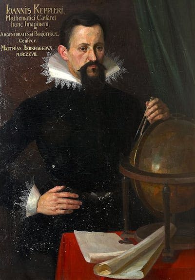 A man with dark hair and beard, wearing dark clothing with a fancy collar, placing one hand on his hip and the other on a globe.