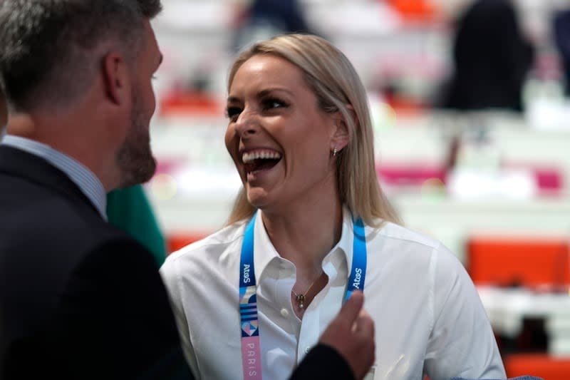 US skier Lindsey Vohn, speaks to Michael Hanks Maughan, from the Salt Lake City delegation, during the IOC session at the 2024 Summer Olympics, Wednesday, July 24, 2024, in Paris, France. | David Goldman