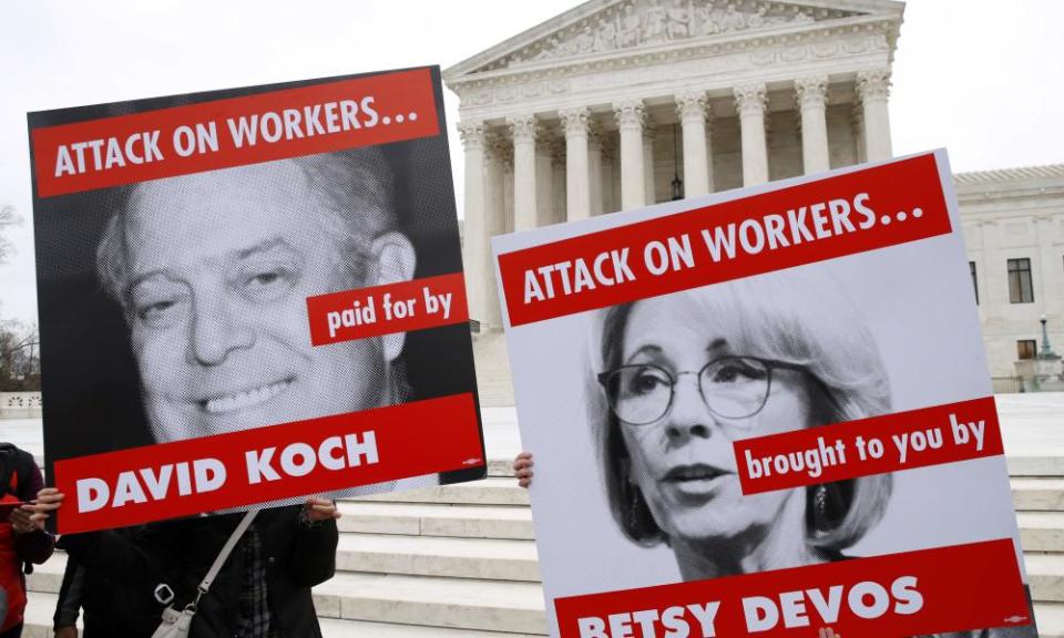 Protesters in support of unions outside of the Supreme Court, on Monday in Washington. The Supreme Court heard arguments in a case that could deal a blow to organized labor. 