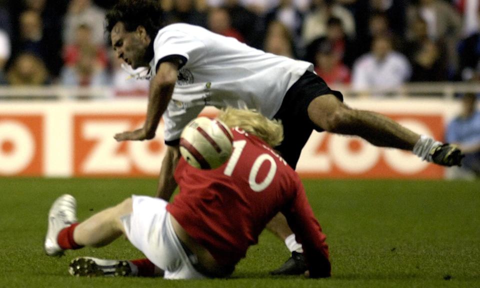 Boris Johnson tackling Germany’s Maurizio Gaudino during the Legends celebrity football match at the Madejski Stadium in Reading in 2006.