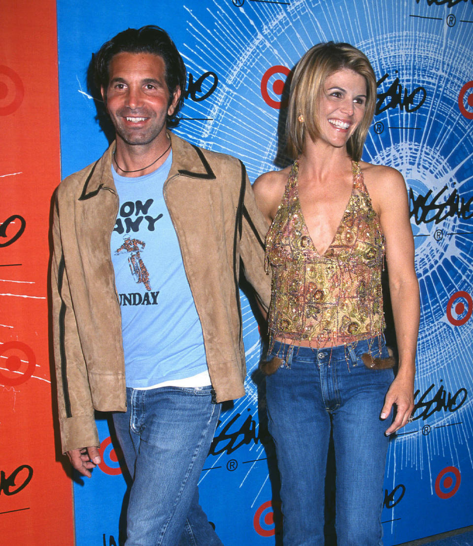 Photo by: RE/Westcom/STAR MAX/IPx 2019 4/15/19 Lori Loughlin and her husband Mossimo Giannulli enter not guilty pleas in college admission scandal. STAR MAX Stock Photo: 2001 Lori Loughlin and Mossimo Giannulli