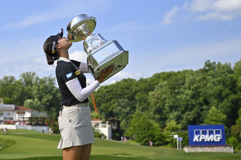 In Gee Chun kisses the trophy, after winning the KPMG Women's PGA Championship on Sunday, June 26, 2022, in Bethesda, Md.