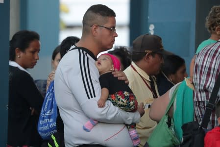 Venezuelans wait at the Binational Border Service Center of Peru in Tumbes
