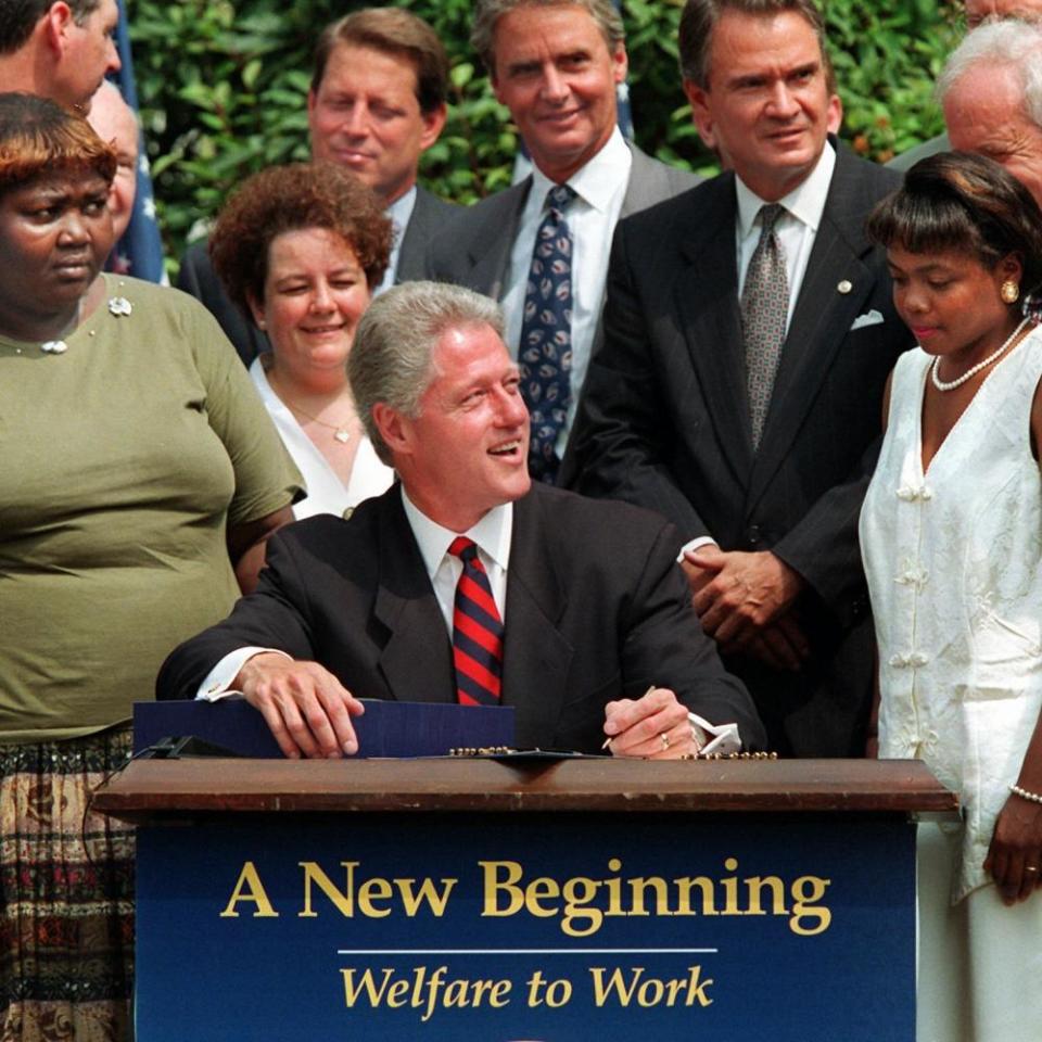 Bill Clinton prepares to welfare reform legislation in 1996.