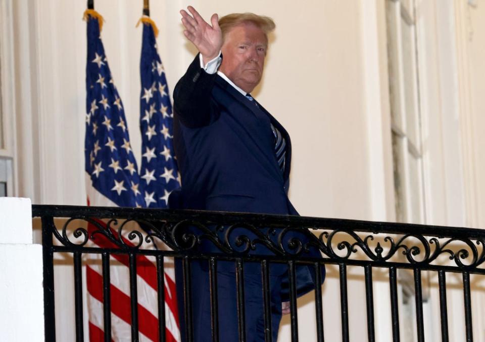 US president Donald Trump waves upon return to the White House from Walter Reed National Military Medical Center on October 05, 2020 in Washington, DC. Trump spent three days hospitalized for coronavirus.Getty Images