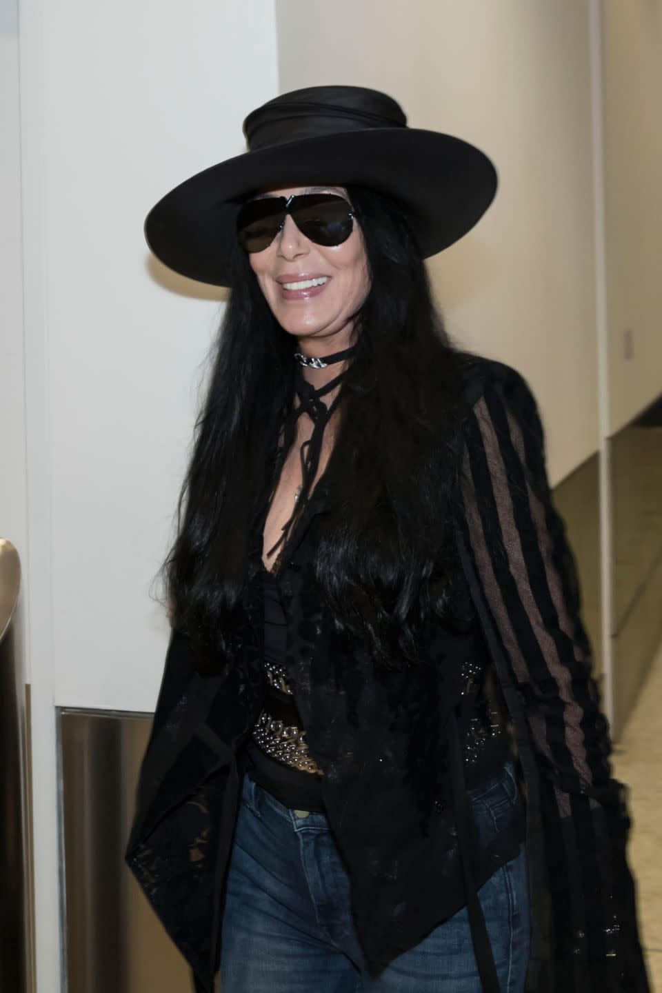 Looking chic in some jeans paired with a black top, black jacket and black hat, the star looked happy as she was pictured at Sydney airport on Wednesday morning. Source: Getty