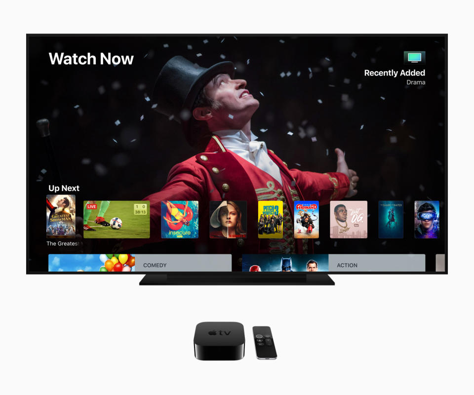 Apple TV content displayed on a TV next to an Apple TV box and Siri remote.