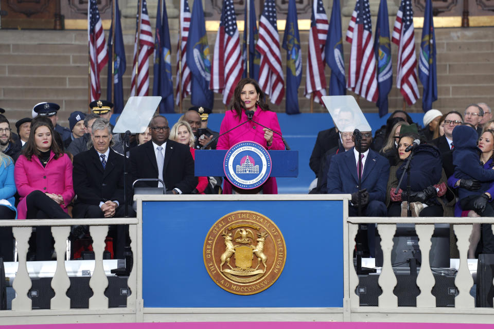 Michigan Gov. Gretchen Whitmer addresses the crowd during inauguration ceremonies, Sunday, Jan. 1, 2023, outside the state Capitol in Lansing, Mich. (AP Photo/Al Goldis)