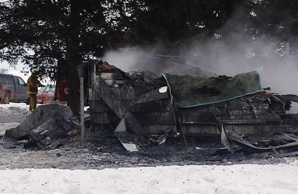 In this photo provided by the Fayette County, Iowa, Sheriff's Office is the scene of a fire that destroyed a house Friday, Jan. 24, 2014 in Arlington, Iowa, and killed at least five, according to authorities. Officials said the property was damaged so badly it may be difficult for officials to collect enough evidence that could shed light on what started the fire. (AP Photo/Fayette County Sheriff's Office)