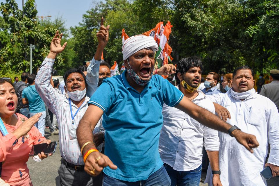 Congress Party activists shout slogans during an anti-government demonstration to protest against the recent passing of new farm bills in parliament in New Delhi on September 28, 2020. (Photo by Sajjad HUSSAIN / AFP) (Photo by SAJJAD HUSSAIN/AFP via Getty Images)