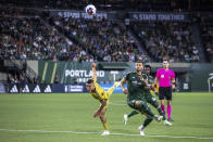 Portland Timbers defender Dario Zuparic, right, and Real Salt Lake's Braian Ojeda, left, watch the ball during an MLS soccer match Wednesday, Aug. 30, 2023, in Portland, Ore. (Sean Meagher/The Oregonian via AP)