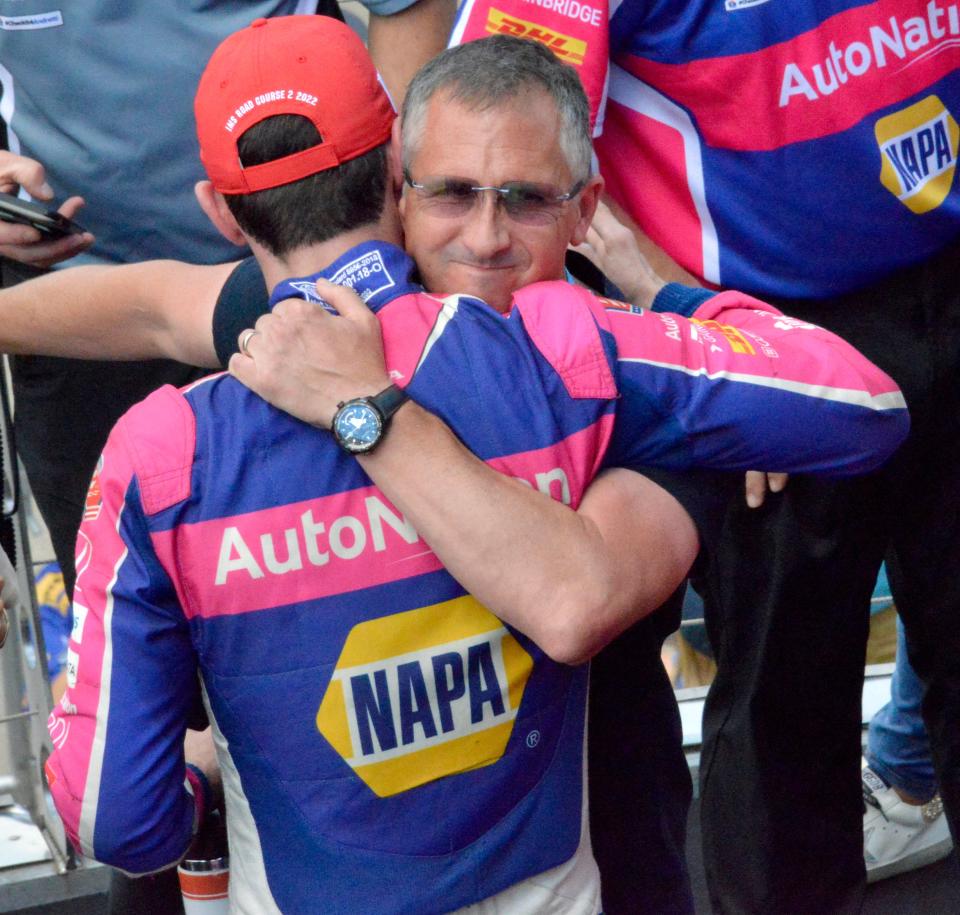 Andretti Autosport driver Alexander Rossi (27) is hugged by his father, Pieter Rossi, on Saturday, July 30, 2022, after winning the Gallagher Grand Prix at Indianapolis Motor Speedway.