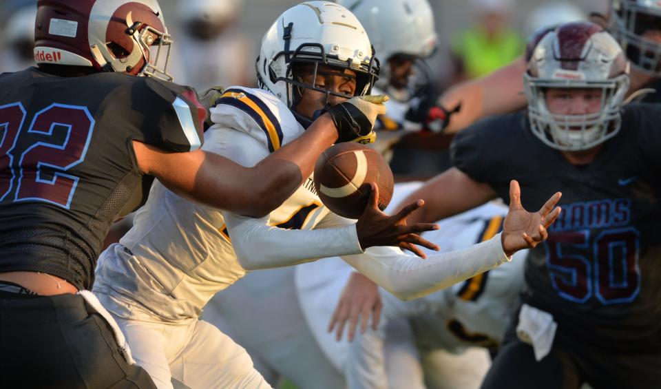 Lehigh quarterback Dorian Mallary (#14) loses that ball as he tries to break through the Riverview defensive line. Riverview High School hosted Lehigh High School in a spring football game on Friday evening, May 26, 2023. 