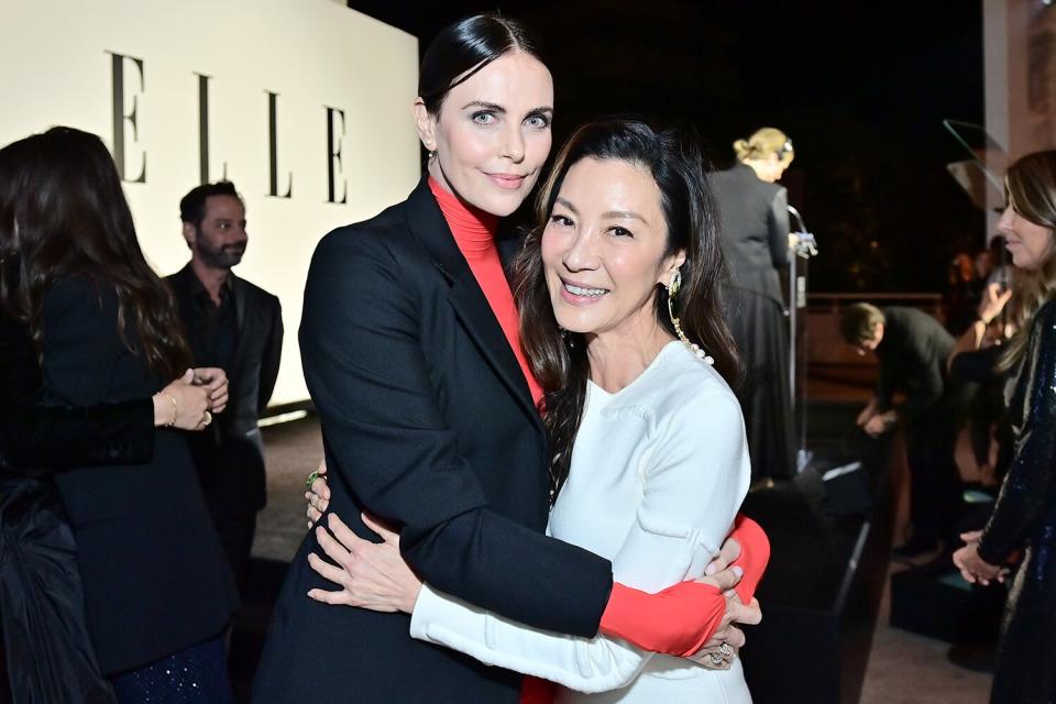 Charlize Theron and honoree Michelle Yeoh attend ELLE's 29th Annual Women in Hollywood celebration presented by Ralph Lauren, Amyris and Lexus at Getty Center on October 17, 2022 in Los Angeles, California.