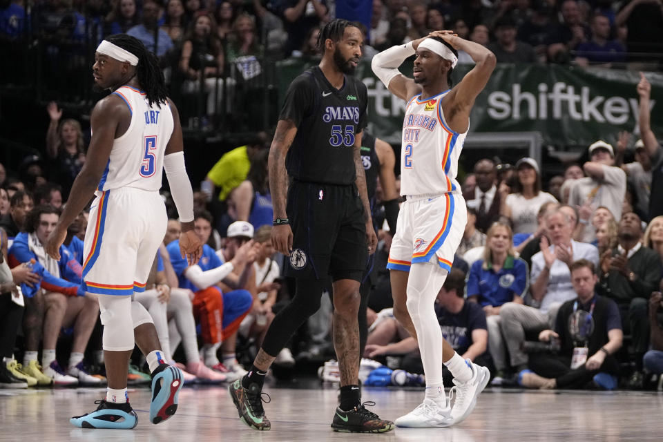 Dallas Mavericks forward Derrick Jones Jr. (55) walks away after Oklahoma City Thunder's Luguentz Dort (5) was issued a foul, as Shai Gilgeous-Alexander (2) looks on in the first half of Game 6 of an NBA basketball second-round playoff series Saturday, May 18, 2024, in Dallas. (AP Photo/Tony Gutierrez)