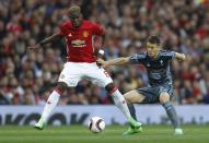 <p>Manchester United’s Paul Pogba in action with Celta Vigo’s Nemanja Radoja </p>