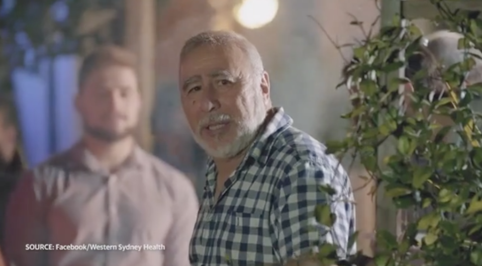 A man speaks in a NSW Health ad. He's at a barbecue.