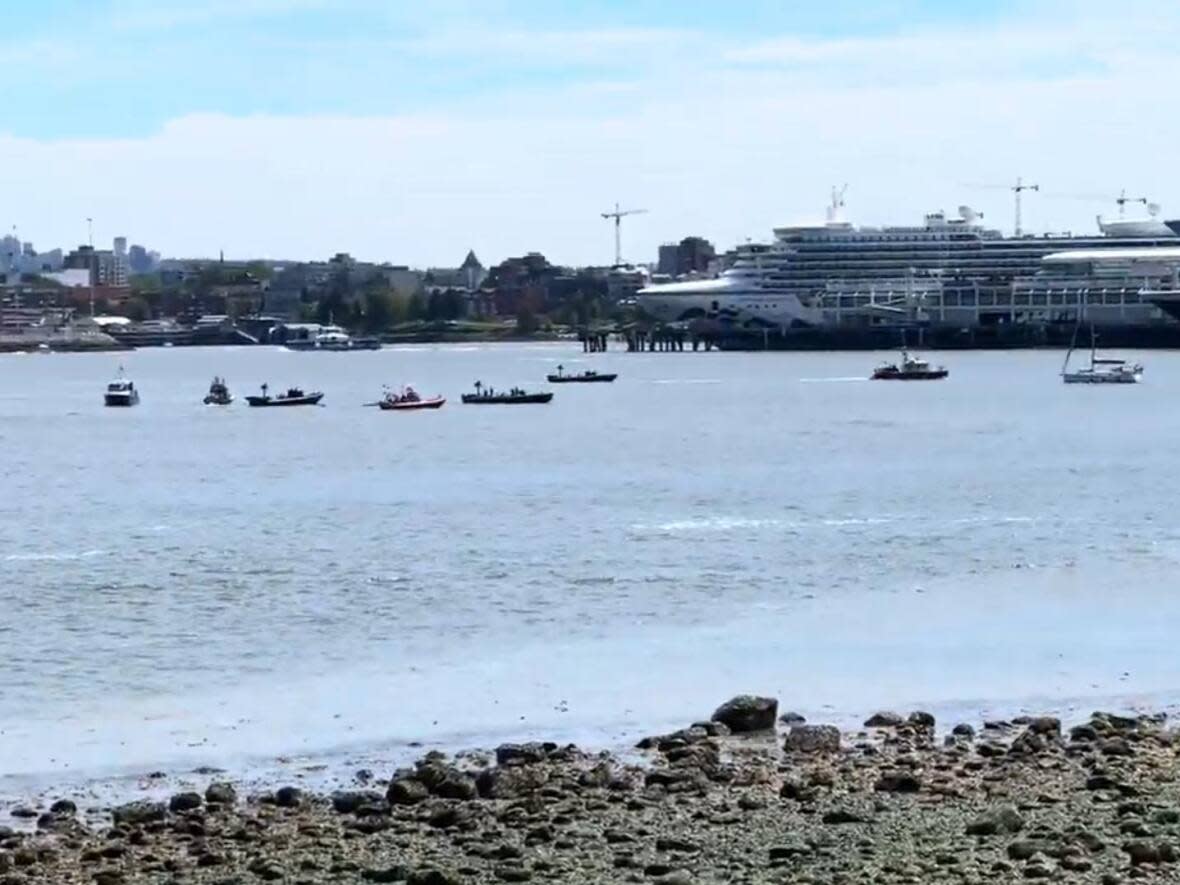 Numerous agencies — including the Vancouver Police Department, Vancouver Fire & Rescue Services and the Coast Guard — were dispatched to Coal Harbour on Saturday. (Submitted by Kwan - image credit)