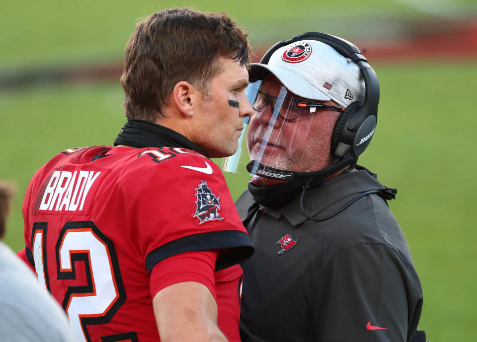 Nov 29, 2020; Tampa, Florida, USA; Tampa Bay Buccaneers head coach Bruce Arians speaks with Tampa Bay Buccaneers quarterback Tom Brady (12) during the first half at Raymond James Stadium. Mandatory Credit: Kim Klement-USA TODAY Sports