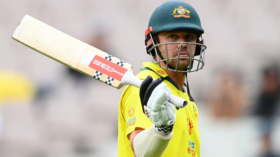 Travis Head raises his bat to fans at the MCG after hitting a career-best 152 runs against England.