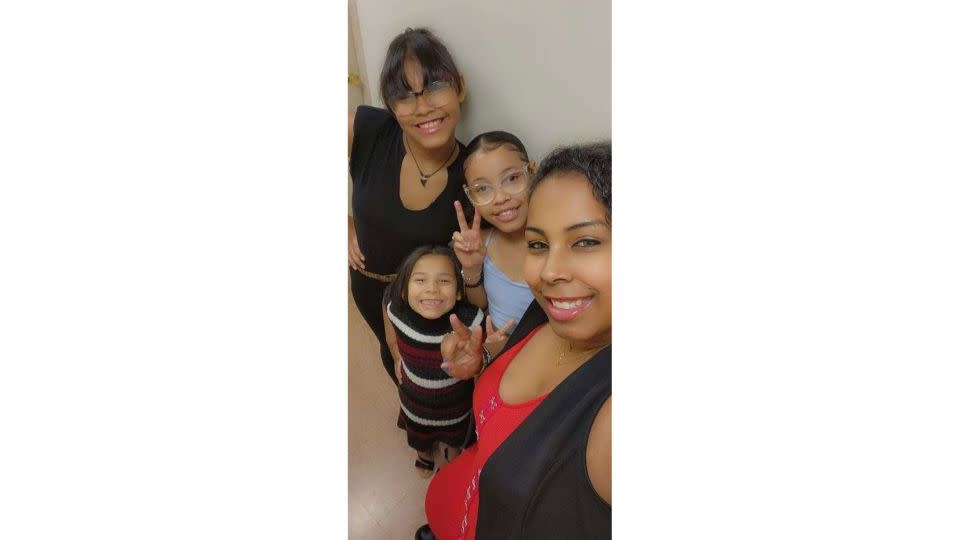 Brexialee "Brexi" Torres-Ortiz, center with glasses, poses with her family. - Courtesy Brenlee Ortiz