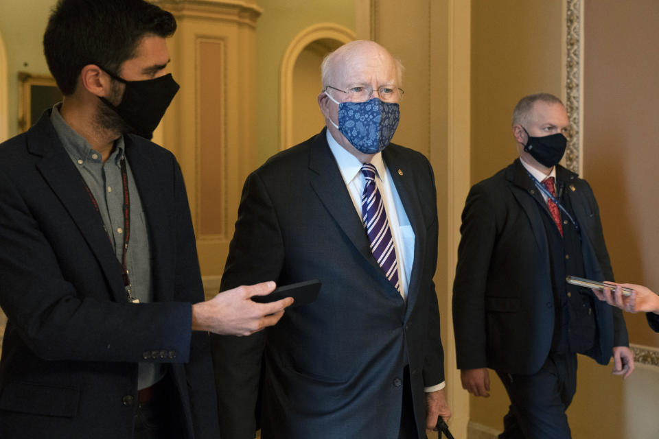 Sen. Patrick Leahy, D-Vt., walks with reporters, Tuesday, Jan. 26, 2021, as he leaves the Senate floor on Capitol Hill in Washington. (AP Photo/Jacquelyn Martin)