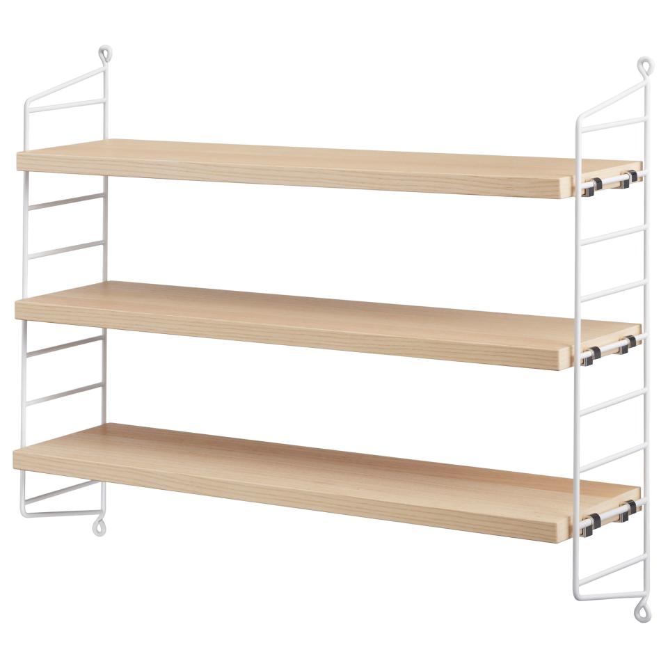 <strong>The Shelves That Don't Compromise On Floor Space</strong><br><br>Not only do these shelves give added floor space (which really helps with the illusion of space), the metal sides give extra hanging possibilities.<br><br><strong>String</strong> Pocket Shelves, $, available at <a href="https://www.johnlewis.com/string-pocket-shelves/walnut/p3364844" rel="nofollow noopener" target="_blank" data-ylk="slk:John Lewis & Partners" class="link ">John Lewis & Partners</a>