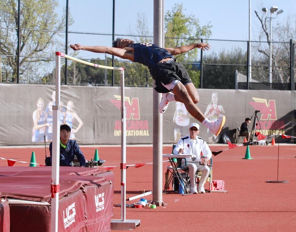 Birmingham senior Deshawn Banks clears the bar to win the boys' high jump.