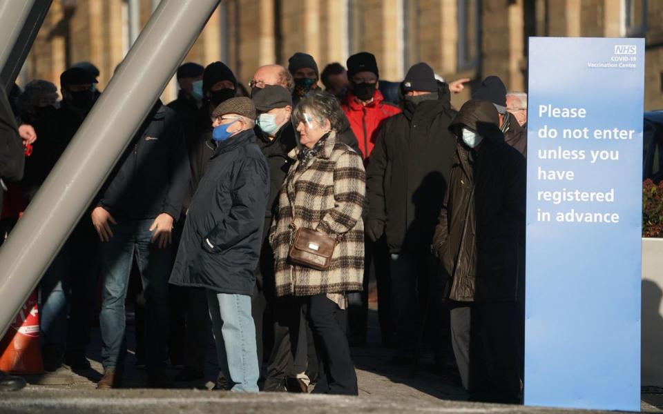 Members of the public arrive to receive their injection of a Covid-19 vaccine at the NHS vaccine centre at the Centre for Life in Times Square, Newcastle - Owen Humphreys/ PA