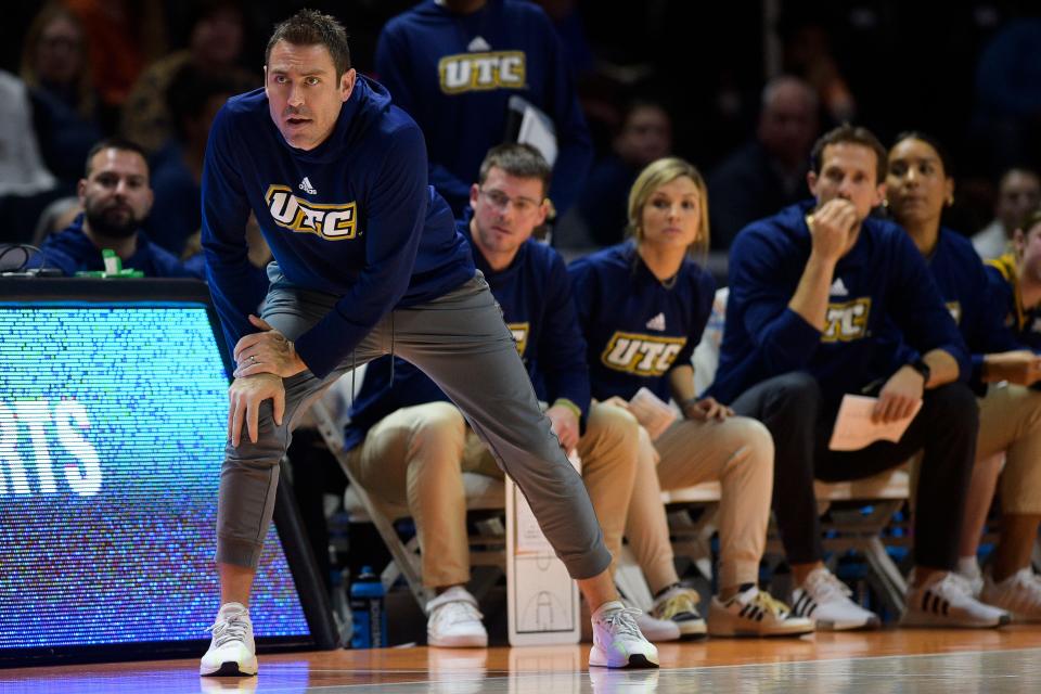 Chattanooga Head Coach Shawn Poppie eyes the game between Tennessee and Chattanooga at Thompson-Boling Arena in Knoxville, Tenn., on Tuesday, Dec. 6, 2022.