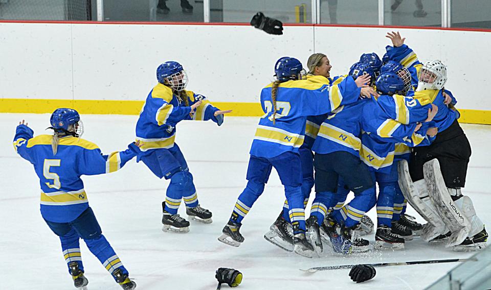 Members of the Aberdeen Cougars celebrate their 1-0 victory over the Sioux Falls Flyers during the championship game of the 2024 South Dakota Amateur Hockey Association's varsity girls state tournament on Sunday, March 3, 2024 in Watertown's Prairie Lakes Ice Arena.